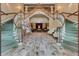 Elegant double staircase in a spacious entryway, leading to a large community room at 3506 Mulberry Grove Loop, Leesburg, FL 34748