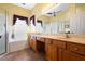 Double vanity bathroom with a large soaking tub at 3506 Mulberry Grove Loop, Leesburg, FL 34748