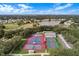 Tennis courts and recreational facilities in a lush setting at 3506 Mulberry Grove Loop, Leesburg, FL 34748