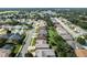 Aerial view of a residential neighborhood with a lake at 3506 Mulberry Grove Loop, Leesburg, FL 34748