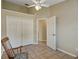Bedroom with tile floors and ceiling fan at 3912 Plantation Blvd, Leesburg, FL 34748
