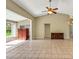 Spacious Gathering room with tile floors and a view of the backyard at 3912 Plantation Blvd, Leesburg, FL 34748