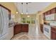 Modern kitchen with granite countertops, ample cabinetry, and a breakfast bar at 3912 Plantation Blvd, Leesburg, FL 34748