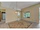 Spacious dining area with tile floors and an area rug, offering natural light at 3912 Plantation Blvd, Leesburg, FL 34748