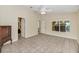 Bright bedroom with tile floors and access to the bathroom at 3912 Plantation Blvd, Leesburg, FL 34748