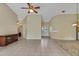 Living room with tile floors and views to the entryway and other rooms at 3912 Plantation Blvd, Leesburg, FL 34748
