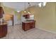 Kitchen boasts granite countertops, dark wood cabinets, and modern appliances at 3912 Plantation Blvd, Leesburg, FL 34748
