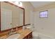 Bathroom with granite countertop and bathtub shower combo at 3912 Plantation Blvd, Leesburg, FL 34748