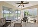 Screened porch with seating and golf course view at 27227 Roanoke Dr, Leesburg, FL 34748