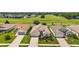 Aerial view of houses and a golf course at 27227 Roanoke Dr, Leesburg, FL 34748
