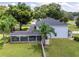 House with large backyard, covered patio, and pool at 7425 Lake Marni Ct, Mount Dora, FL 32757