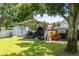 Backyard with covered boat storage and shed at 7425 Lake Marni Ct, Mount Dora, FL 32757