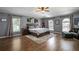 Spacious main bedroom with hardwood floors and sitting area at 7425 Lake Marni Ct, Mount Dora, FL 32757