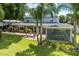 Spacious backyard with patio, screened enclosure, and lush landscaping at 7425 Lake Marni Ct, Mount Dora, FL 32757