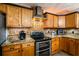 Updated kitchen with double oven, granite counters, and wood cabinets at 7425 Lake Marni Ct, Mount Dora, FL 32757