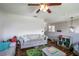 Playroom with hardwood floors, toys, and a comfy couch at 7425 Lake Marni Ct, Mount Dora, FL 32757