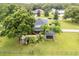 Aerial view of house and backyard, showcasing landscaping at 7425 Lake Marni Ct, Mount Dora, FL 32757