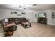 Spacious living room with a sectional sofa and a fireplace at 7425 Lake Marni Ct, Mount Dora, FL 32757