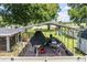 Covered boat storage area with two boats and a shed at 7425 Lake Marni Ct, Mount Dora, FL 32757