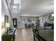 Open dining room and living area with large windows and natural light at 7425 Lake Marni Ct, Mount Dora, FL 32757