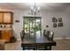 Bright dining area with a wooden table and access to the backyard at 7425 Lake Marni Ct, Mount Dora, FL 32757