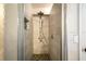 Stand-up shower with multiple shower heads and tile flooring at 7425 Lake Marni Ct, Mount Dora, FL 32757