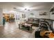 Open living room with views of kitchen and dining area at 7425 Lake Marni Ct, Mount Dora, FL 32757