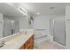 Bathroom boasts double sinks, a bathtub, and shower at 36649 Sundance Dr, Grand Island, FL 32735