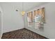 Bright dining area with neutral decor and carpet flooring at 36649 Sundance Dr, Grand Island, FL 32735
