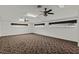 Bright bonus room featuring new carpeting and ceiling fans at 36649 Sundance Dr, Grand Island, FL 32735