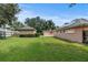 Large grassy backyard with a storage shed at 36649 Sundance Dr, Grand Island, FL 32735