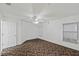 Bright bedroom with ceiling fan and neutral carpeting at 36649 Sundance Dr, Grand Island, FL 32735