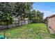 Spacious backyard with wooden fence and green grass at 36649 Sundance Dr, Grand Island, FL 32735