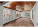 Sunroom features wood ceilings, tile floors, and fans at 36649 Sundance Dr, Grand Island, FL 32735