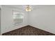 Bright bedroom featuring a ceiling fan and window at 36649 Sundance Dr, Grand Island, FL 32735