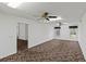 Spacious bonus room with carpeting, ceiling fan, and multiple windows at 36649 Sundance Dr, Grand Island, FL 32735