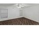 Spacious bedroom with ceiling fan and neutral carpeting at 36649 Sundance Dr, Grand Island, FL 32735