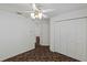 Well-lit bedroom with double door closet and carpet at 36649 Sundance Dr, Grand Island, FL 32735