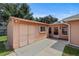 Exterior view of a spacious storage shed with concrete patio at 36649 Sundance Dr, Grand Island, FL 32735