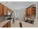 Kitchen boasts wood cabinets, ample counter space, and a tile floor at 36649 Sundance Dr, Grand Island, FL 32735