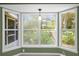 View of kitchen with a bay window and access to a backyard at 1500 Cobble Ln, Mount Dora, FL 32757
