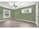Well-lit bedroom featuring wood-look floors and a ceiling fan at 1500 Cobble Ln, Mount Dora, FL 32757