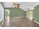 Large living room with wood-look floors and sliding glass doors at 1500 Cobble Ln, Mount Dora, FL 32757