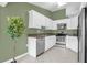 Kitchen with white cabinets, stainless steel appliances, and granite countertops at 1500 Cobble Ln, Mount Dora, FL 32757