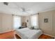 Bright bedroom with hardwood floors and ceiling fan at 1311 E 5Th Ave, Mount Dora, FL 32757