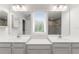 Double vanity bathroom with large mirrors and a walk-in shower at 2186 Swinstead Dr, Sanford, FL 32773