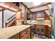 Modern kitchen with granite countertops and wood cabinets at 507 Lakeshore Dr, Eustis, FL 32726
