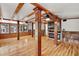 Open living area with hardwood floors, a fireplace, and built-in entertainment center at 507 Lakeshore Dr, Eustis, FL 32726