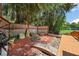 Landscaped backyard with a zen garden, stone pathways, and wood fencing at 507 Lakeshore Dr, Eustis, FL 32726