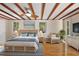 Large main bedroom with hardwood floors and wicker furniture at 507 Lakeshore Dr, Eustis, FL 32726